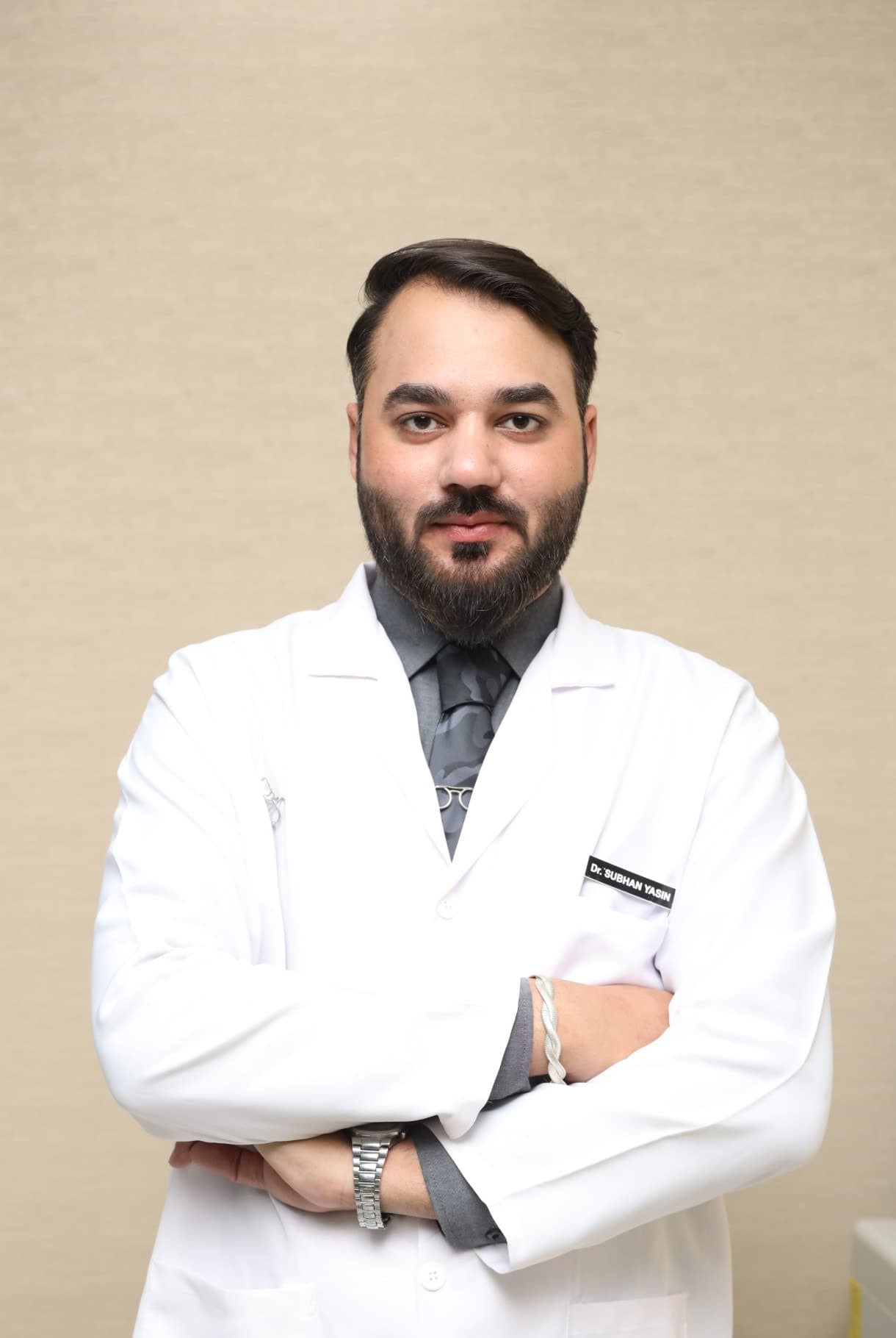 Dr. Subhan Yasin, aesthetic physician, in a white coat